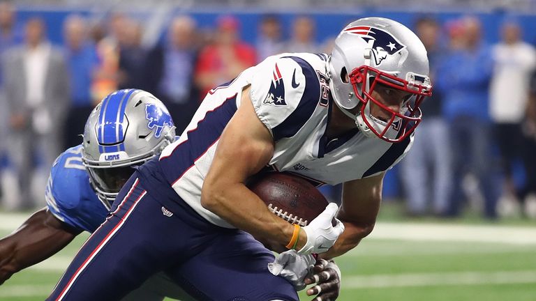 DETROIT, MI - AUGUST 25: Chris Hogan #15 of the New England Patriots scores a first quarter touchdown past the tackle of Jarrad Davis #40 of the Detroit Li