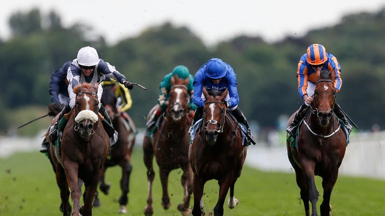 YORK, ENGLAND - AUGUST 23:  Jim Crowley riding Ulysses (L, white cap) win The Juddmonte International Stakes from Churchill (R) at York racecourse on Augus
