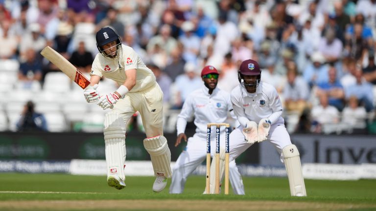 England batsman Joe Root picks up some runs watched by keeper Shane Dowich during day one of the 2nd Investec Test match v Windies