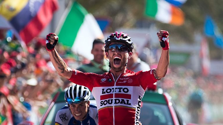 Lotto Soudal's Polish cyclist Tomasz Marczynski celebrates as he crosses the finish line to win the 6th stage of the 72nd edition of "La Vuelta" 