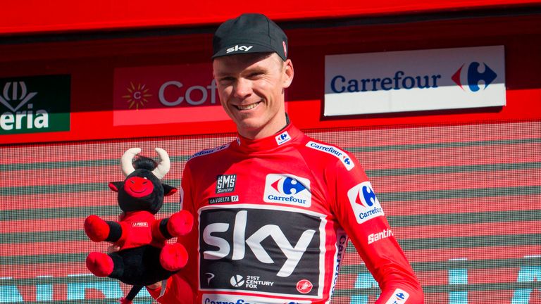 Sky's British cyclist Chris Froome poses on the podium with the leader's red jersey at the end of the 3rd stage of the 72nd edition of "La Vuelta"