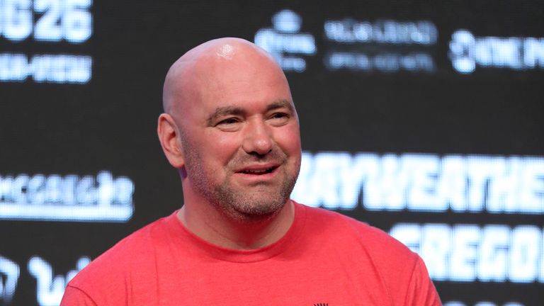 UFC president Dana White looks on before UFC champion Conor McGregor steps on the scale during his official weigh-in