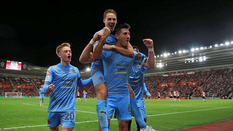 Wolves' Danny Batth (centre) celebrates scoring his side's first goal during the Carabao Cup, Second Round match at St Mary's Stadium, Southampton