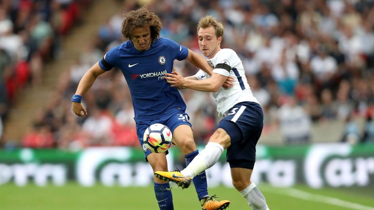 LONDON, ENGLAND - AUGUST 20: David Luiz of Chelsea and Christian Eriksen of Tottenham Hotspur battle for possession during the Premier League match between