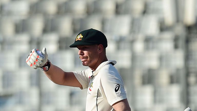 Australian cricketer David Warner gestures after scoring a half century (50 runs) during the third day of the first Test cricket match between Bangladesh a