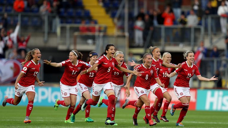 Denmark players celebrate their team's victory on penalties over Austria