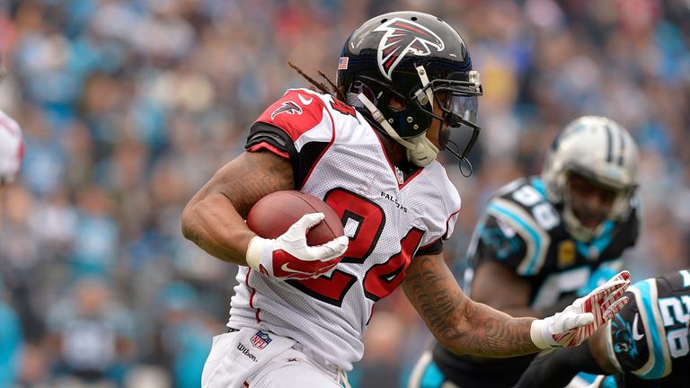 CHARLOTTE, NC - DECEMBER 24:  Devonta Freeman #24 of the Atlanta Falcons runs the ball against the Carolina Panthers in the 1st quarter during the game at 