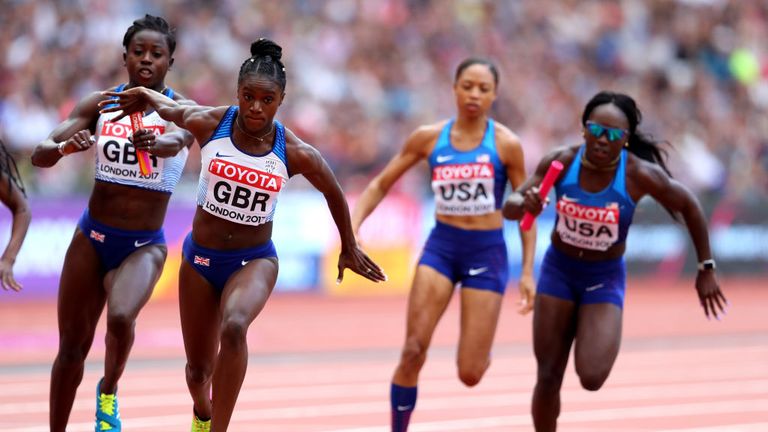 Deriree Henry of Great Britain hands the baton to Dina Asher-Smith in the 4 X 100 Metres Relay heats at 2017 World Athletics Championships