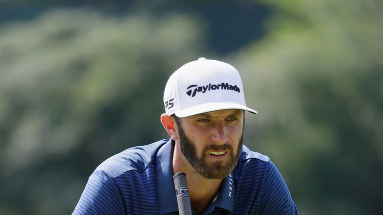 WESTBURY, NY - AUGUST 27:  Dustin Johnson of the United States lines up a putt on the fifth green during the final round of The Northern Trust at Glen Oaks