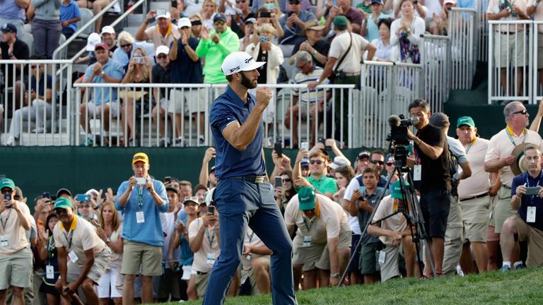 WESTBURY, NY - AUGUST 27:  Dustin Johnson of the United States celebrates putting for birdie on the 18th green to defeat Jordan Spieth of the United States