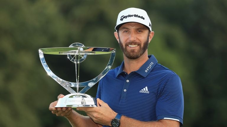 WESTBURY, NY - AUGUST 27:  Dustin Johnson of the United States poses with the trophy after putting for birdie on the 18th green to defeat Jordan Spieth of 