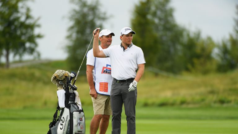 PRAGUE, CZECH REPUBLIC - AUGUST 31:  Eddie Pepperell of England and his caddie look along the 18th hole fairway during day one of the D+D REAL Czech Master