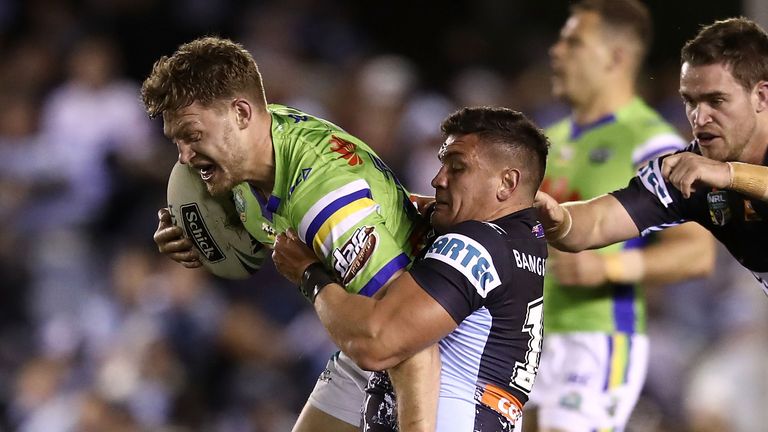 Elliot Whitehead of the Raiders is tackled during the round 22 NRL match against Cronulla 