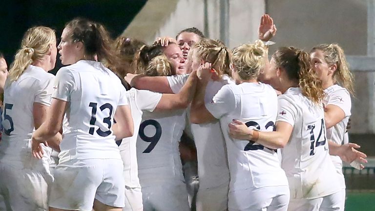 England's players celebrate their first try, scored by Sarah Bern, during the Women's Rugby World Cup 2017 semi-final match between England and France at T