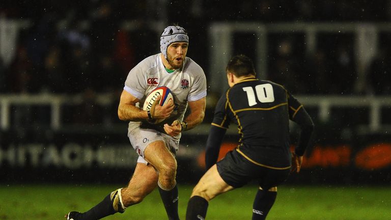 NEWCASTLE UPON TYNE, ENGLAND - FEBRUARY 01:  Will Fraser of England Saxons is tackled by Tom Heathcote of Scotland during the International Friendly match 