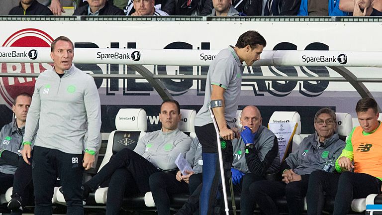 Celtic's Erik Sviatchenko (right) on crutches after suffering a knee injury  against Rosenborg