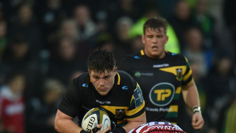 NORTHAMPTON, ENGLAND - NOVEMBER 12:  Ethan Waller of Northampton Saints is tackled by Ollie Thorley of Gloucester Rugby during the Anglo-Welsh Cup match be