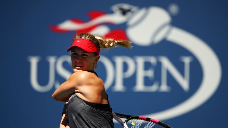 Eugenie Bouchard of Canada returns a shot to Evgeniya Rodina of Russia after their first round Women's Singles match on Day Three of the US Open