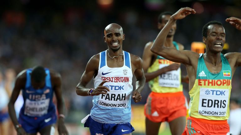 Great Britain's Mo Farah (left) appears dejected 