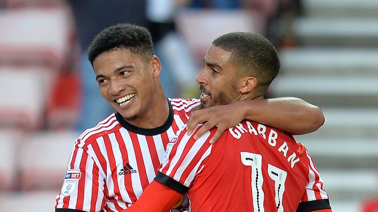 Lewis Grabban celebrates with team-mate Tyias Browning after scoring from the penalty spot