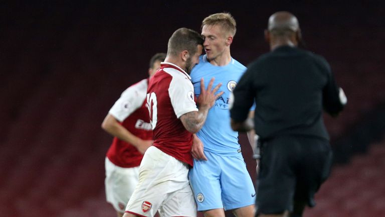 Jack Wilshere shoves Matthew Smith of Manchester City leadin gto his sending off during the Premier League 2 match at the Emirates Stadium