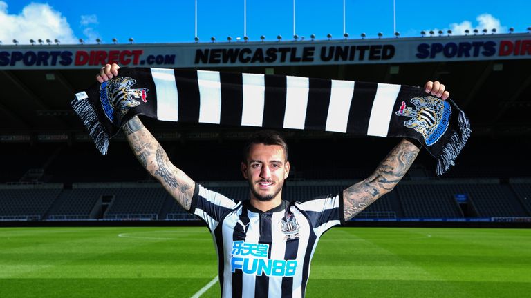 Joselu poses for photographs during his unveiling at St.James' Park