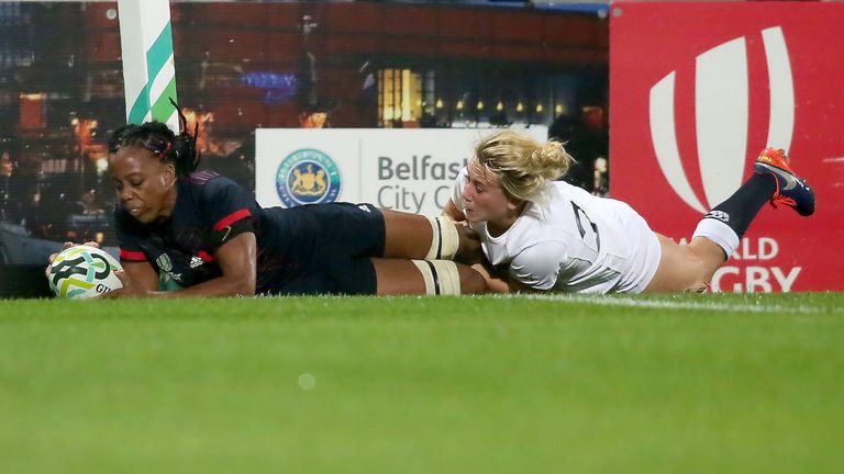 France's Julie Annery (L) over the line, tackled by England's , with a disallowed try during the Women's Rugby World Cup 2017 semi-final match be
