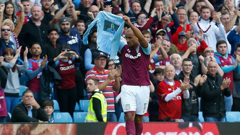 Gabby Agbonlahor celebrates his goal by holding up a t-shirt in support of Wolves player Carl Ikeme