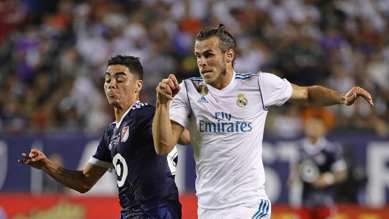 Gareth Bale battles with Miguel Almiron during a match between MLS All-Stars and Real Madrid in Chicago