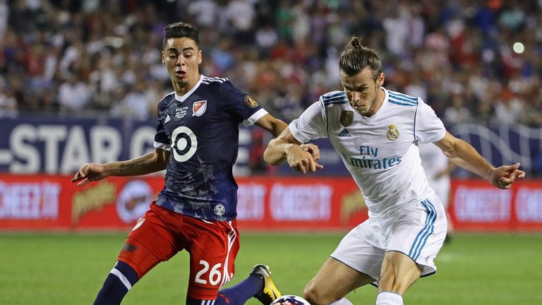 CHICAGO, IL - AUGUST 02:  Gareth Bale #11 of Real Madrid fires a shot past Miguel Almiron #26 of the MLS All-Stars during the 2017 MLS All- Star Game at So