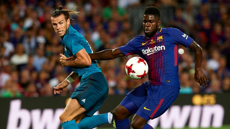 Gareth Bale challenges Samuel Umtiti in the first half of the Spanish Super Cup first leg