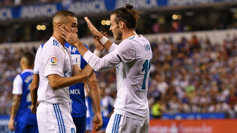 LA CORUNA, SPAIN - AUGUST 20: Gareth Bale of Real Madrid scores the first goal and celebrates whit teammates during the La Liga match between Deportivo La 