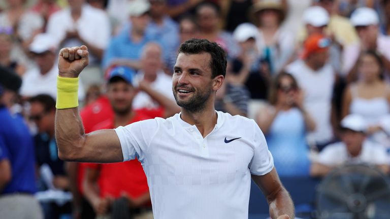 MASON, OH - AUGUST 20:  Grigor Dimitrov of Bulgaria celebrates after defeating Nick Kyrgios of Australia to win the men's final during Day 9 of of the West