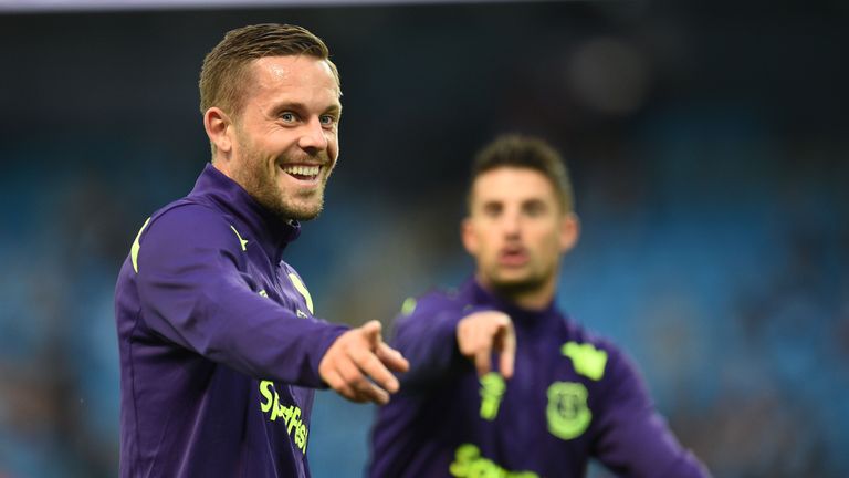 Gylfi Sigurdsson  warms up with Kevin Mirallas prior to kick off