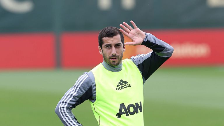 Henrikh Mkhitaryan stretches during a first team training session at the Aon Training Complex