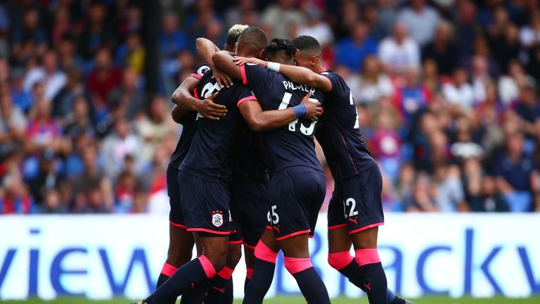 LONDON, ENGLAND - AUGUST 12: The Huddersield Town team celebrate their first goal of the game during the Premier League match between Crystal Palace and Hu
