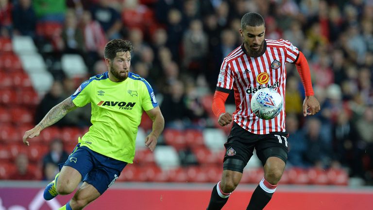 SUNDERLAND, ENGLAND - AUGUST 04: Lewis Grabban (R), of Sunderland takes on Jacob Butterfield of Derby County during the Sky Bet Championship match between 