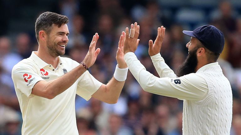 England's James Anderson celebrates after wicketkeeper Jonny Bairstow caught out West Indies batsman Devendra Bishoo