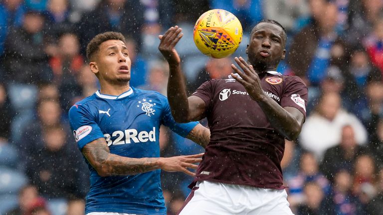 Rangers' James Tavernier and Hearts' Esmael Goncalves tussle for the ball