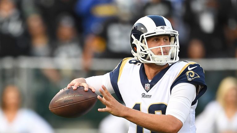 OAKLAND, CA - AUGUST 19: Jared Goff #16 of the Los Angeles Rams rolls out to pass against the Oakland Raiders during the first quarter of their preseason N