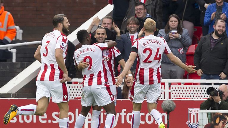 Stoke City striker Jese (C) celebrates with team-mates after scoring the opening goal of the Premier League football match v Arsenal