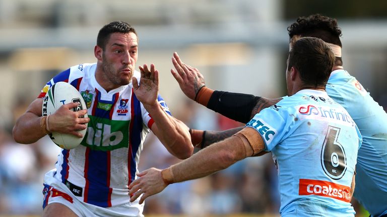 SYDNEY, AUSTRALIA - APRIL 01:  Joe Wardle of the Knights is tackled during the round five NRL match between the Cronulla Sharks and the Newcastle Knights a