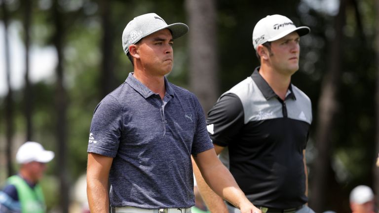 CHARLOTTE, NC - AUGUST 10: Rickie Fowler of the United States and jr walk up the third hole during the first round of the 2017 PGA Championship at Quail Ho