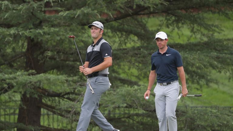 CHARLOTTE, NC - AUGUST 10: Jon Rahm of Spain and Rory McIlroy of Northern Ireland putt on the seventh hole  during the first round of the 2017 PGA Champion