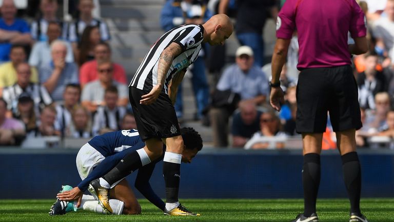 NEWCASTLE UPON TYNE, ENGLAND - AUGUST 13:  Dele Alli of Tottenham Hotspur reacts leading to a red card for Jonjo Shelvey of Newcastle United (c)  during th
