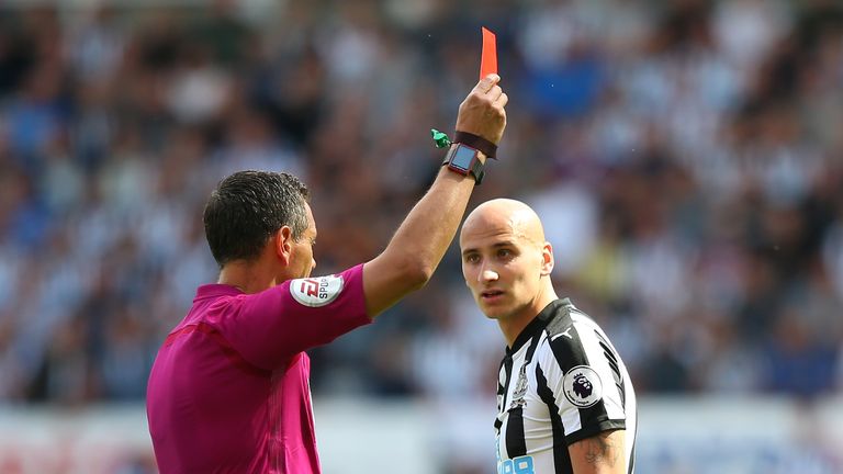 Andre Marriner shows a red card to Jonjo Shelvey of Newcastle United 