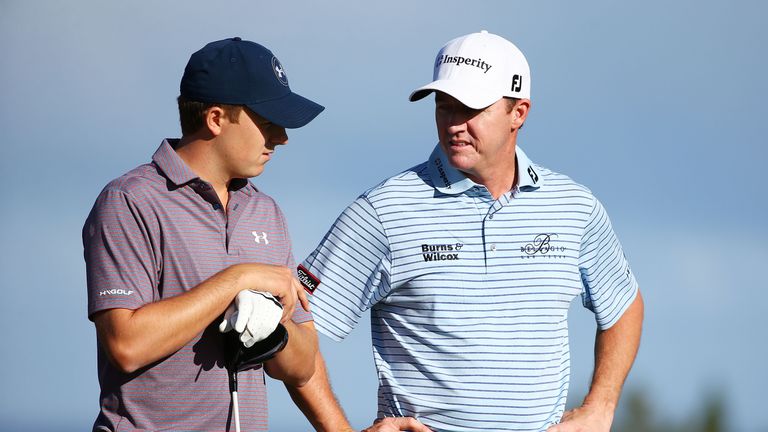 Jordan Spieth (L) talks to Jimmy Walker