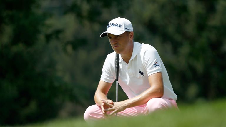 AKRON, OH - AUGUST 03: Justin Thomas lines up a putt on the 13th green during the first round of the World Golf Championships - Bridgestone Invitational at