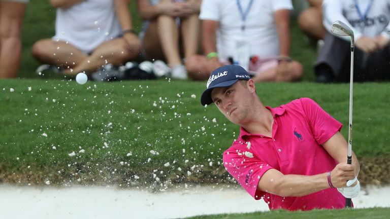 Justin Thomas of the United States plays a shot from a bunker on the first hole  during the final round of the 2017 PGA Championship