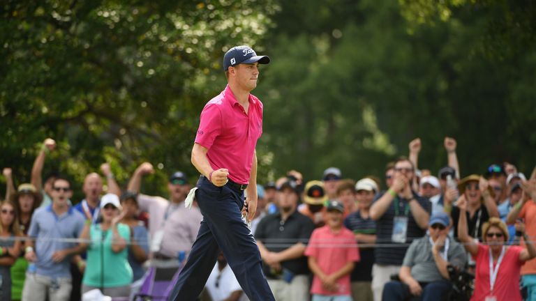 Justin Thomas of the United States reacts to his birdie putt on the ninth green during the final round of the 2017 PGA Championship